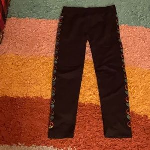 Black rainbow peace sign pants